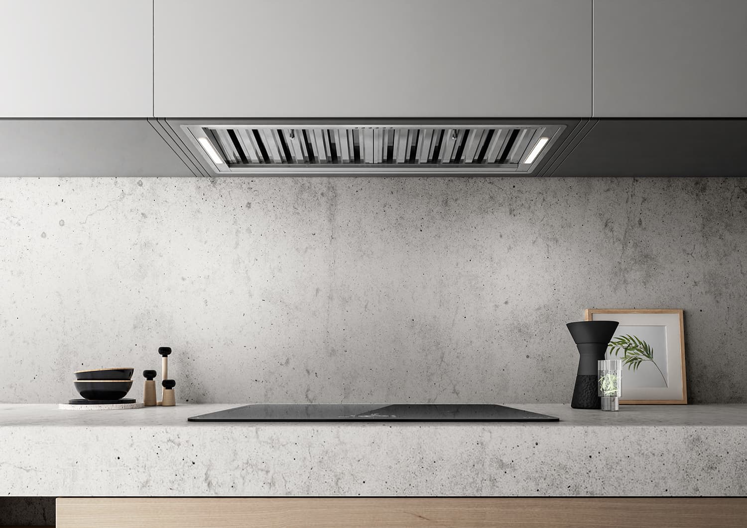 Modern stainless steel kitchen range hood mounted above cooktop with LED lighting and touch controls in clean Cape Town kitchen